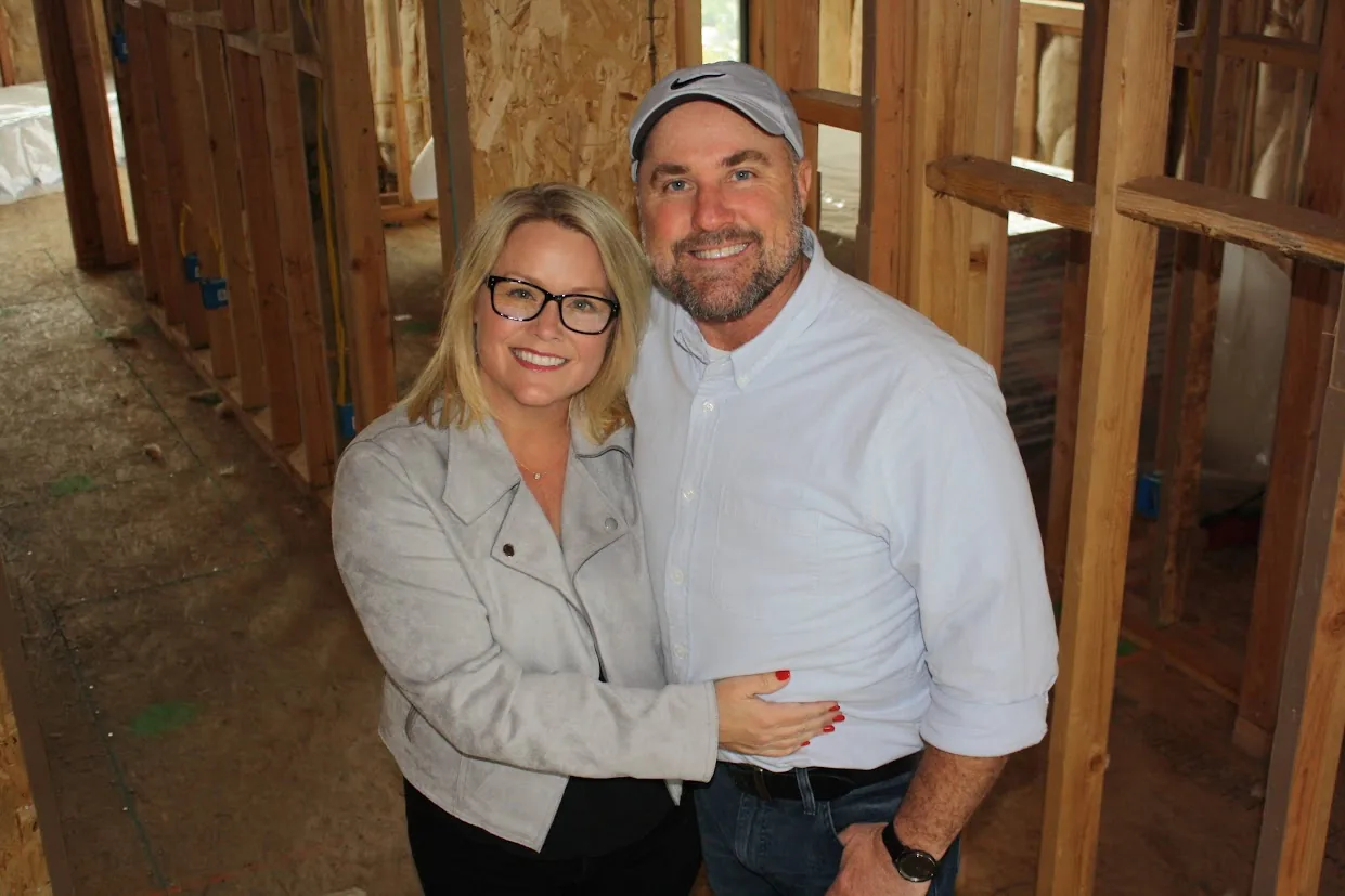Tim and Angela Ryan inside a framed home