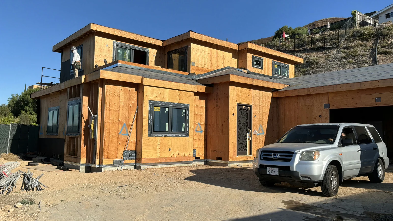 Hillside custom home during framing and sheathing