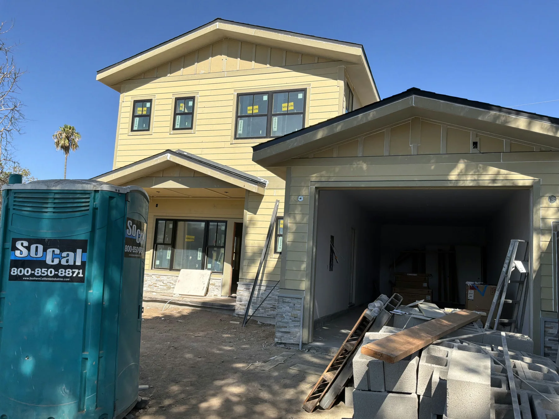 Residential exterior construction progressing toward finish work