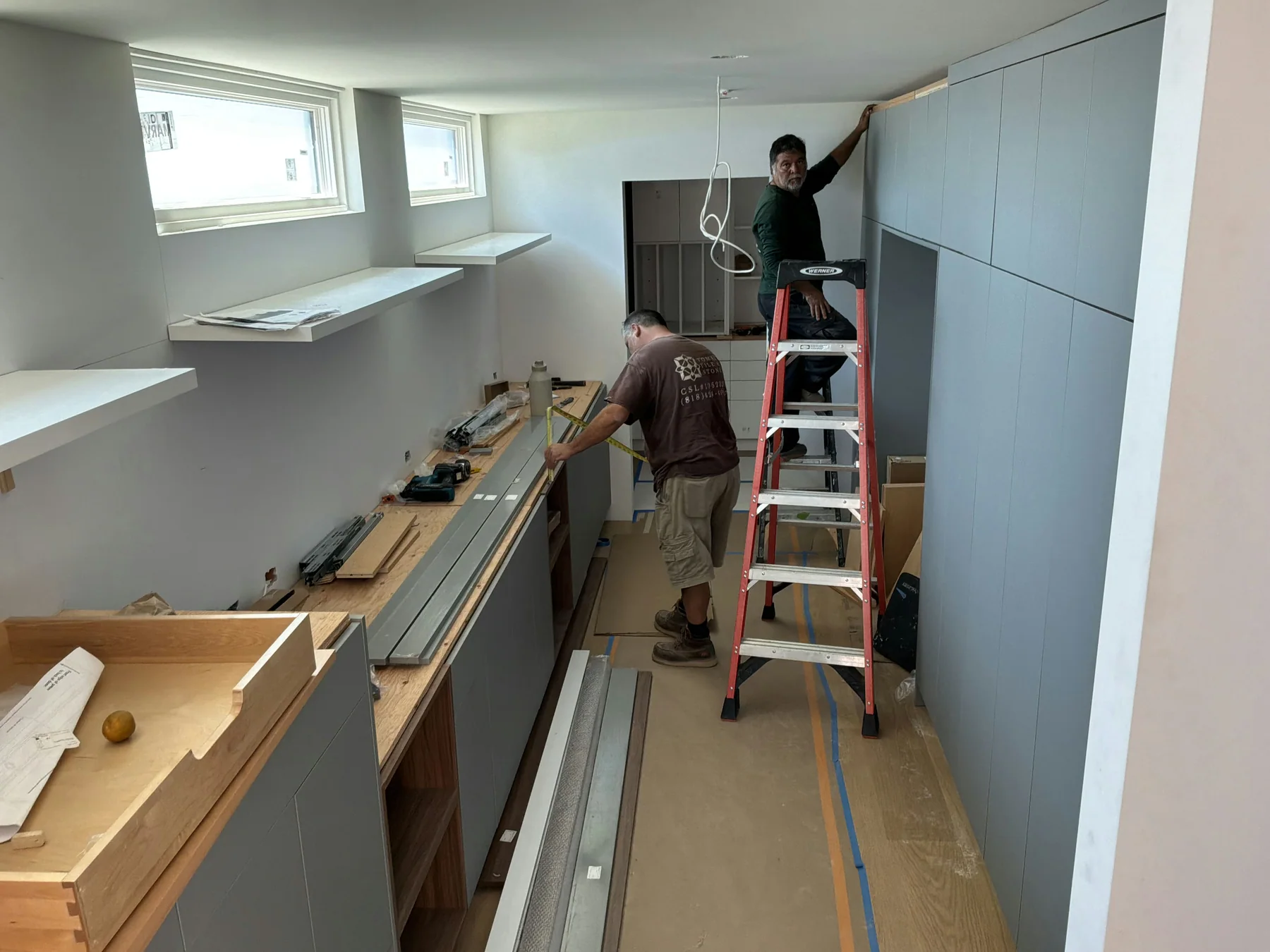 Cabinet installation underway inside a residential construction project
